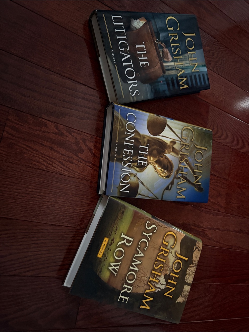 3 John Grisham hardcover books